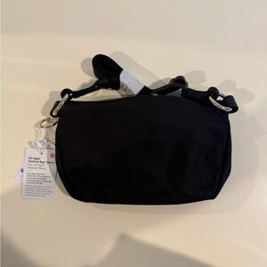 Lululemon All Night Festival Bag. Black Nylon with Gold Hardware. New with tags